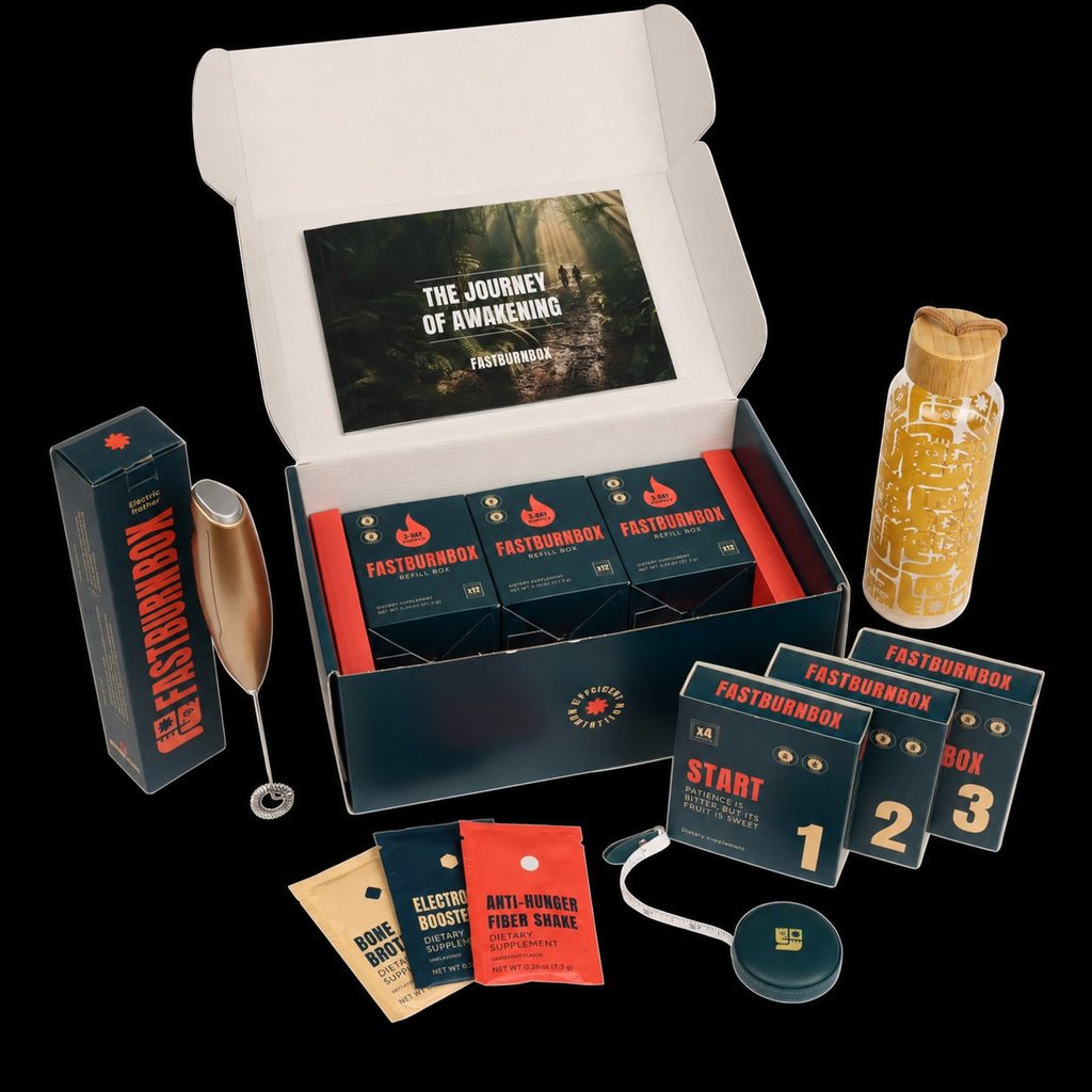 Open FastBurnBox Ultimate kit on black: refill cartons, step boxes 1-3, frother, bottle, sachets and guide