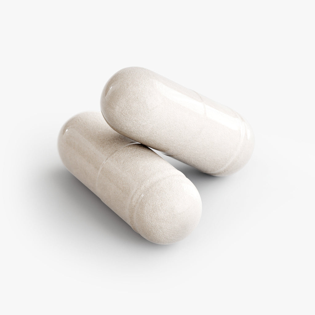 Two off-white Resveratrol capsules on a plain white background